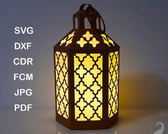 May include: A brown paper lantern template with intricate cut-out designs. The lantern is lit from within, casting a warm glow. The image includes the text "PAPER LANTERN TEMPLATE" and a list of file formats: SVG, DXF, CDR, FCM, JPG, PDF.