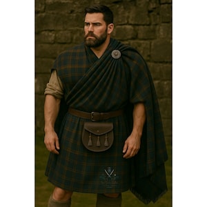 May include: A person wearing a traditional Scottish kilt outfit. The outfit includes a dark green and brown plaid kilt, a matching shawl, a brown leather belt, and a brown leather sporran. A decorative brooch secures the shawl.