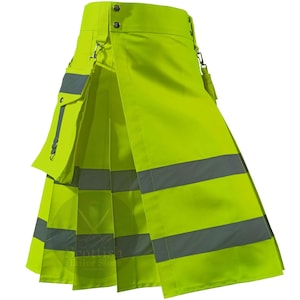 Puede incluir: Kilt amarillo verdoso brillante con rayas grises reflectantes y un bolsillo. El kilt tiene cierres metálicos y un diseño plisado. El texto "Scottish Tailor Store" es visible en la parte inferior.