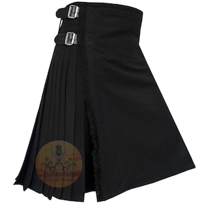 May include: Black kilt with pleats and a fringe detail. The kilt has two buckles on the side.