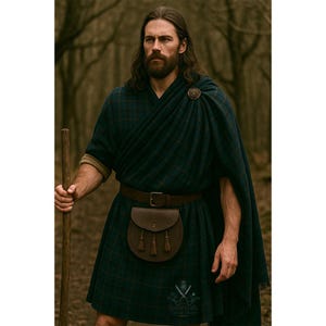 May include: A person wearing a traditional Scottish outfit. The outfit includes a dark green and blue plaid kilt, a matching shawl, and a brown leather belt with a pouch. A wooden staff is held in one hand. A decorative brooch secures the shawl.