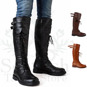 May include: Black leather knee-high boots with buckles and laces. The boots have a side zipper and are shown with jeans. Two additional boots are displayed in brown and tan.