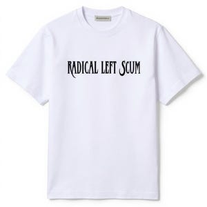 May include: White t-shirt with the text "RADICAL LEFT SCUM" in black, gothic-style font across the chest. The shirt has a crew neck and short sleeves. The brand name is visible at the neckline.