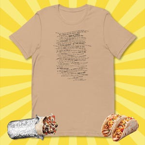 May include: A tan t-shirt with a black print of a song about a "Bucket of Chips". The shirt is displayed on a yellow and white background with a burrito and two tacos in the foreground.