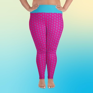 May include: Pink leggings with a blue waistband and a repeating pattern of blue and pink stylized flowers.