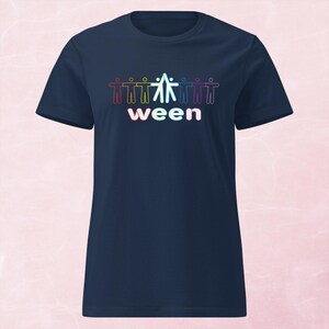 May include: Navy blue t-shirt featuring a graphic of stylized figures in a rainbow gradient, holding hands above the word "ween" in white. The design is centered on the front of the shirt, creating a vibrant and eye-catching look.