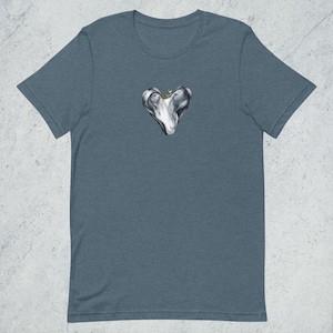 May include: A dark blue t-shirt with a white heart-shaped design. The heart is filled with a swirling, abstract pattern and has a small green detail at the top.
