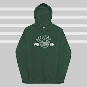 May include: A dark green hooded sweatshirt with a white outline of a cartoon face and the text "WE'EN" on the front.