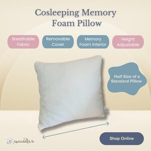 May include: A white memory foam pillow with a removable cover. The pillow is half the size of a standard pillow and is height adjustable. The pillow is breathable and has a memory foam interior. The text "Cosleeping Memory Foam Pillow" is at the top of the image. The text "Shop Online" is at the bottom of the image.