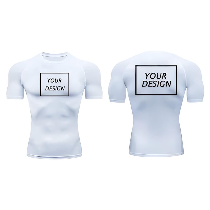 May include: White compression shirt with short sleeves, featuring the text "YOUR DESIGN" in a black rectangle on the front and back. The shirt is designed to fit the contours of the body.