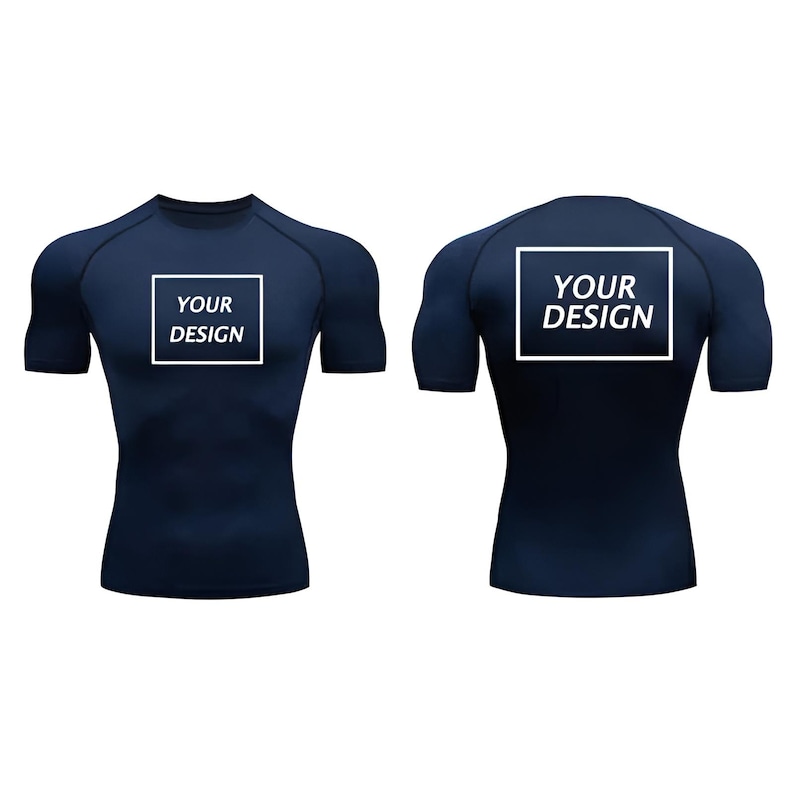 May include: Navy blue compression shirt with short sleeves. The front and back of the shirt feature a white square with the text "YOUR DESIGN". The shirt is form-fitting and designed for athletic activities.