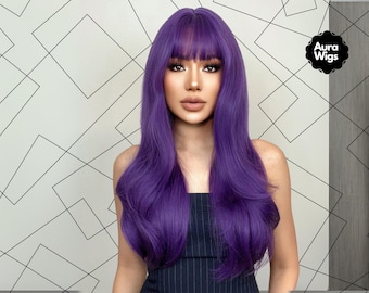 May include: A woman with long, wavy, purple hair and bangs. The hair is styled with a side part and falls to the shoulders. She is wearing a dark blue top. The Aura Wigs logo is visible in the upper right corner.
