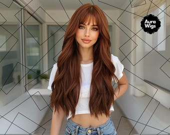 May include: A woman with long, wavy auburn hair and bangs. She is wearing a white crop top and blue jeans. The image includes the text "Aura Wigs" in a black circle.