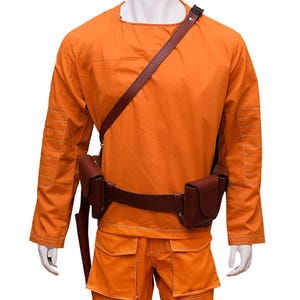 This listing features a high-quality, screen-accurate Star Wars Rebel Pilot/Prisoner Costume Replica, perfect for cosplayers, collectors, and fans. The outfit includes a bright orange flight suit with detailed stitching, padded knee panels, and large utility pockets for an authentic look. A brown leather belt with holsters and an adjustable cross-body strap completes the ensemble, making it a must-have for conventions, cosplay Mandalorian events, and Star Wars enthusiasts.  Halloween, Comic-Con.