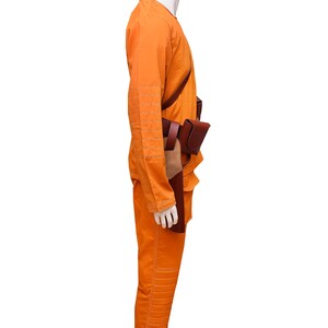 This listing features a high-quality, screen-accurate Star Wars Rebel Pilot/Prisoner Costume Replica, perfect for cosplayers, collectors, and fans. The outfit includes a bright orange flight suit with detailed stitching, padded knee panels, and large utility pockets for an authentic look. A brown leather belt with holsters and an adjustable cross-body strap completes the ensemble, making it a must-have for conventions, cosplay Mandalorian events, and Star Wars enthusiasts.  Halloween, Comic-Con.