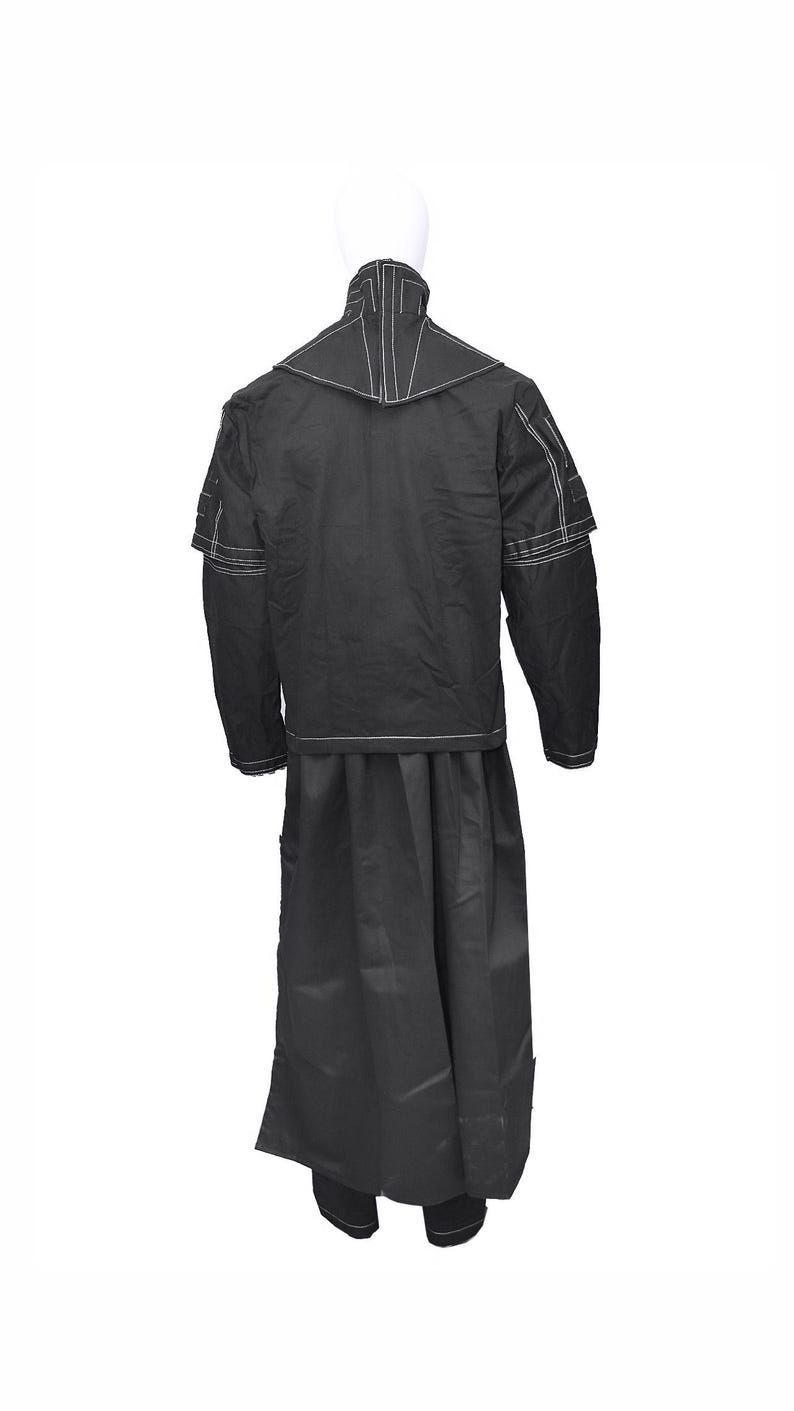 May include: A black long-sleeved jacket with a high collar and white stitching. The jacket has a long skirt attached to it.