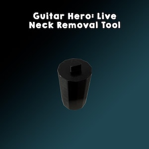 May include: A black guitar neck removal tool with a geometric design. The tool has a cylindrical body with a faceted design and a square top. The text "Guitar Hero: Live Neck Removal Tool" is displayed above the tool.