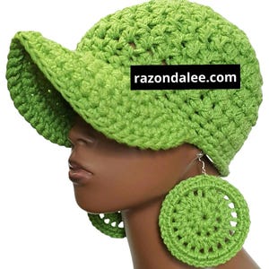 May include: A lime green crocheted hat with a visor and matching circular earrings. The hat and earrings are made of a textured yarn. The website razondalee.com is printed on the hat.