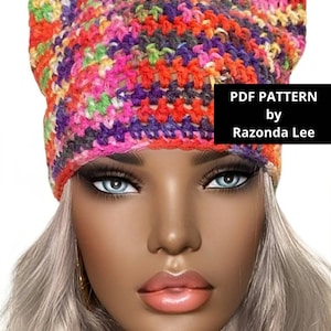 May include: A colorful crochet cat ear beanie hat with a multi-colored yarn. PDF PATTERN by Razonda Lee.