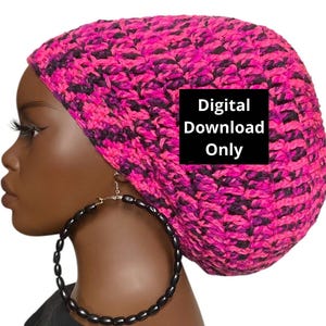 May include: A pink and black crochet beanie with a digital download only label. The beanie is worn by a person with black hoop earrings.