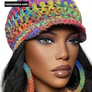 May include: A colorful, crocheted hat with a visor, featuring a vibrant mix of rainbow hues. The hat is paired with matching hoop earrings, also crocheted in the same color scheme. The website razondalee.com is visible on the hat.