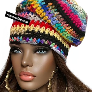 May include: A colorful, handmade crochet beanie in a variety of vibrant colors, including red, yellow, blue, and pink. The beanie has a striped pattern and the text "razondalee.com" is visible.