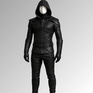 May include: A black leather hooded jacket and matching trousers. The jacket has a zip fastening and a belt at the waist. The trousers have a straight leg.