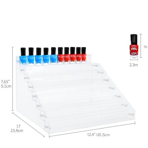 May include: A clear acrylic tiered display stand for nail polish bottles, featuring six rows. The stand measures 7.65 inches in height, 17 inches in width, and 12.4 inches in depth. A single red nail polish bottle is shown with a 1 inch height.