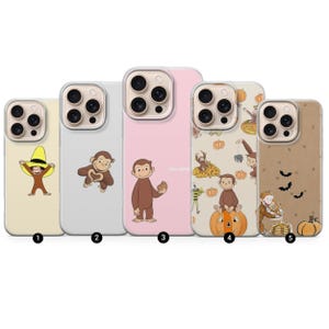 May include: Five phone cases with cartoon monkey designs. The cases are in shades of yellow, grey, pink, and brown. Some cases feature pumpkins and bats. The cases are for mobile phones.
