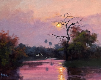 May include: A painting of a sunset over a lake with a bare tree in the foreground. The sky is a soft pink and purple, and the water is reflecting the light of the setting sun. There are a few birds flying in the sky.