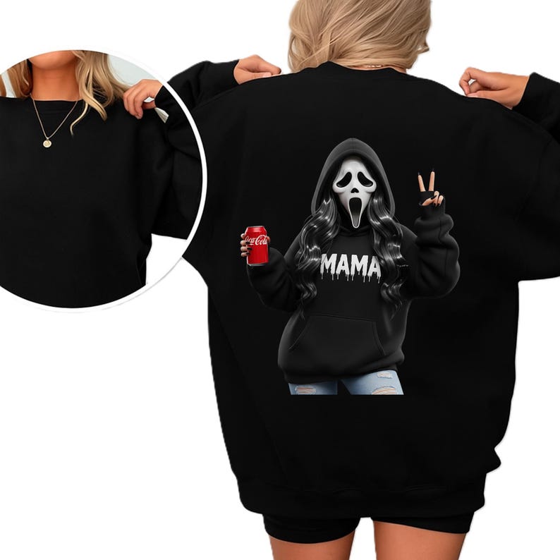May include: Black sweatshirt featuring a graphic of a Scream mask with long black hair, holding a Coca-Cola can. The word "MAMA" is printed below the mask. The sweatshirt is a casual, comfortable style.