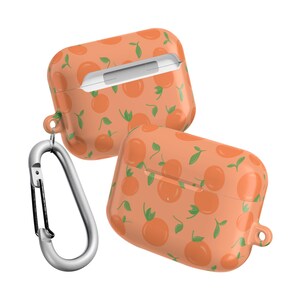 May include: Orange and green patterned Airpod case with a carabiner clip.
