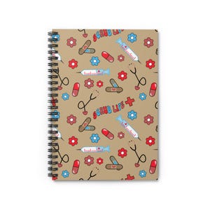May include: A brown spiral notebook with a pattern of red and blue medical symbols, including syringes, pills, bandages, and stethoscopes. The text "SCRUB LIFE" is repeated throughout the pattern.
