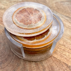 Onderzetters oranje fruithars (4) en houder
