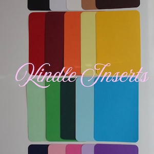 May include: A collection of colorful rectangular inserts in various shades, including red, orange, yellow, green, blue, and purple. The text "Kindle Inserts" is displayed in a cursive font across the image.