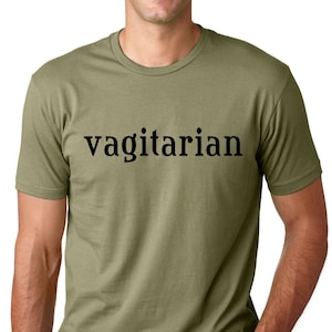 May include: A green t-shirt with the word "vagitarian" printed in black on the front.