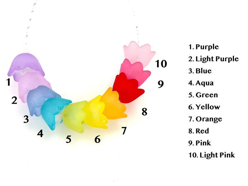May include: A rainbow-colored necklace with ten flower-shaped beads. The beads are in the following order: purple, light purple, blue, aqua, green, yellow, orange, red, pink, and light pink.