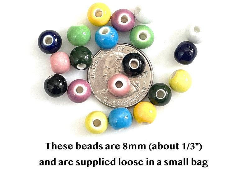 8mm colorful glazed ceramic beads are scattered over a US quarter to show size.  Underneath the photo is text stating that the beads are 8mm, about one third inch in diameter, and that they are supplied loose in a bag.