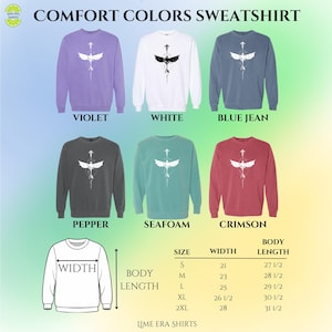 May include: A selection of Comfort Colors sweatshirts in violet, white, blue jean, pepper, seafoam, and crimson. Each has a white graphic. Size and measurement details are included. Widths range from 53 cm to 71 cm.