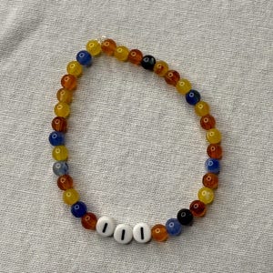 Angel Number 111 Beaded Bracelet. Black, Yellow, Orange, and Blue Acrylic Beads.