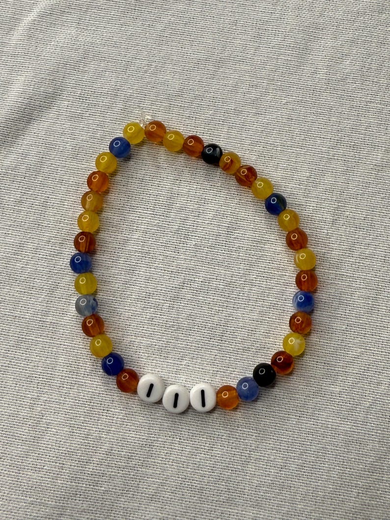 Angel Number 111 Beaded Bracelet. Black, Yellow, Orange, and Blue Acrylic Beads.