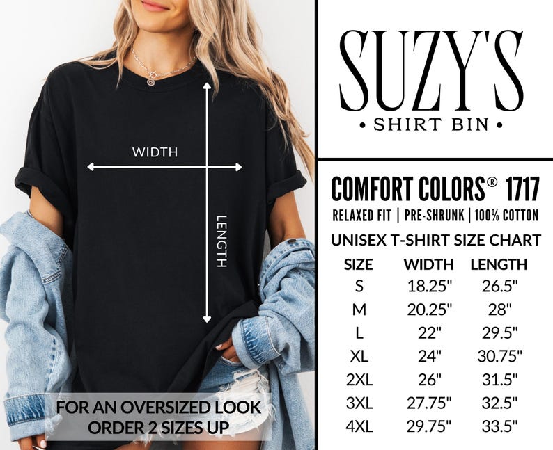 Może przedstawiać: Czarny t-shirt z tabelą rozmiar&oacute;w i napisem "SUZY'S SHIRT BIN." Koszulka ma luźny kr&oacute;j i jest wykonana w 100% z bawełny. Tabela rozmiar&oacute;w pokazuje szerokość i długość w cm.