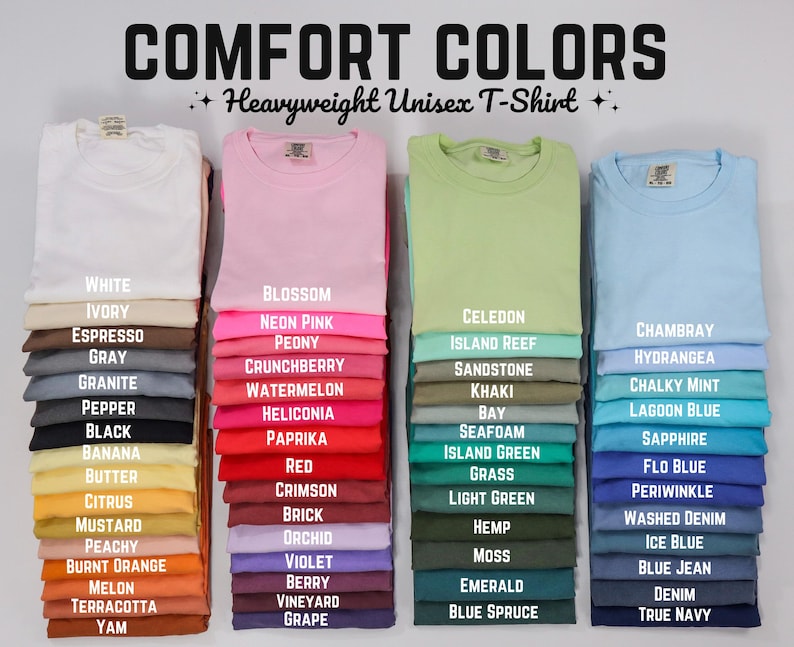 May include: Image of Comfort Colors heavyweight unisex t-shirts in various colors, including white, pink, green, and blue. Each color is labeled with its name, such as "Blossom," "Chambray," and "Emerald." The image showcases a wide range of options.