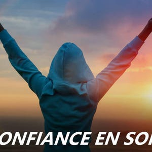 May include: A person with arms raised in the air, wearing a blue hooded sweatshirt, standing in front of a sunset with the text "CONFIANCE EN SOI" in white.