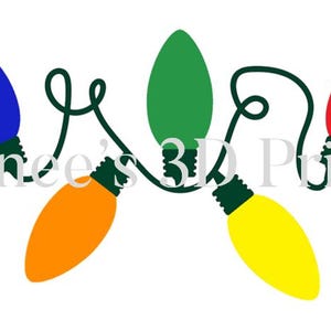 May include: A string of colorful Christmas lights in blue, orange, green, yellow, and red. The lights are connected by a green wire and are set against a white background. The text "Renee's 3D Prints" is in the background.