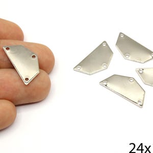 May include: Silver-colored metal jewelry findings in various geometric shapes. Each piece has three small holes for attaching to other materials. The image includes the text "24x12mm".