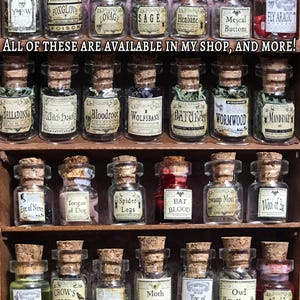 May include: A collection of small glass jars with cork stoppers, each labeled with a different ingredient, such as "Bat Wing" and "Spider Legs." The jars are arranged on wooden shelves. Text on the image reads "This listing is for one jar, please see details."