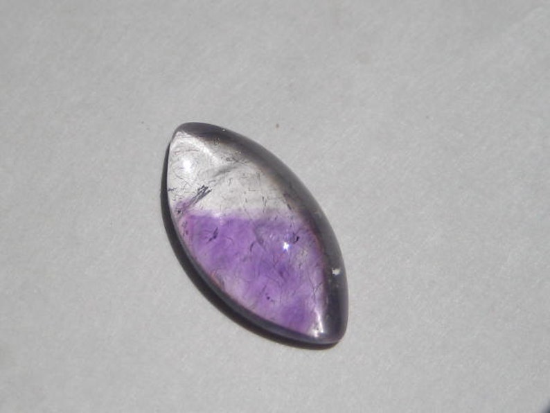 a4380 20 x 10 x 5 mm . Lepidocroiste and Amethyst in Quartz cab .....