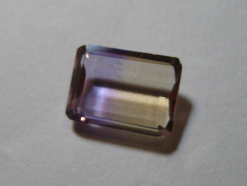Ametrine faceted gemstone ....................... B698 9.5 x 7 x 3.2 mm .....