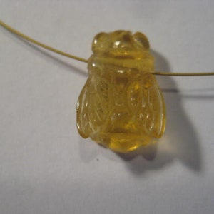 carved Amber Bee bead . Real . Natural Amber .      16 x 12 x 7 mm .         B5305